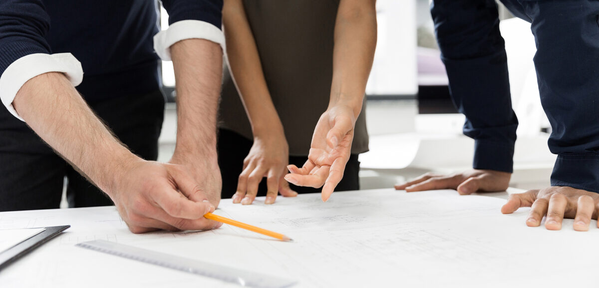 Group of businesspeople working at a table in the office